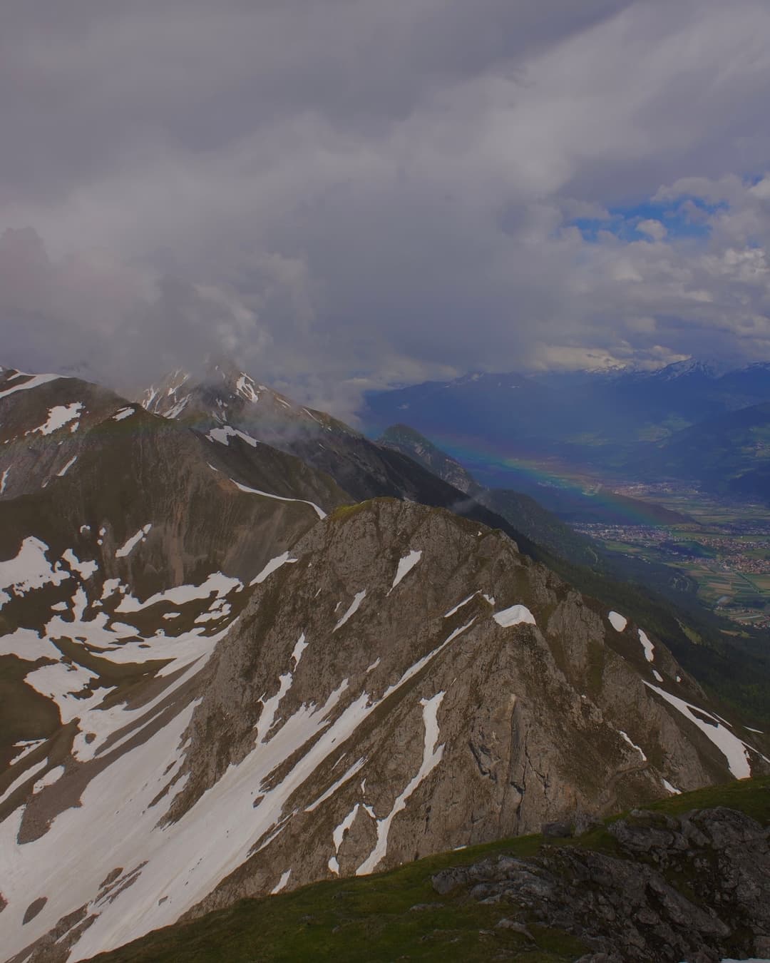 A view + rainbow from the peak of the Alps